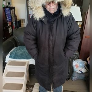 Full length Cabela's women's down coat.